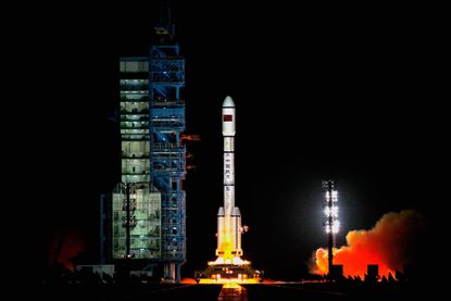 A Long March 2F rocket carrying the country's first space laboratory module Tiangong-1 lifts off from the Jiuquan Satellite Launch Center on September 29, 2011.