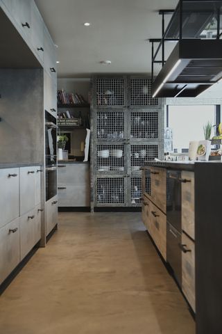 industrial style kitchen with industrial freestanding pantry, metal units