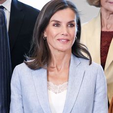 Queen Letizia of Spain in a blue linen suit with white sneakers at a board meeting with the Patronage of the Gallery of the Royal Collections in Madrid, Spain May 2024