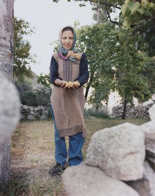 Woman holding apricots