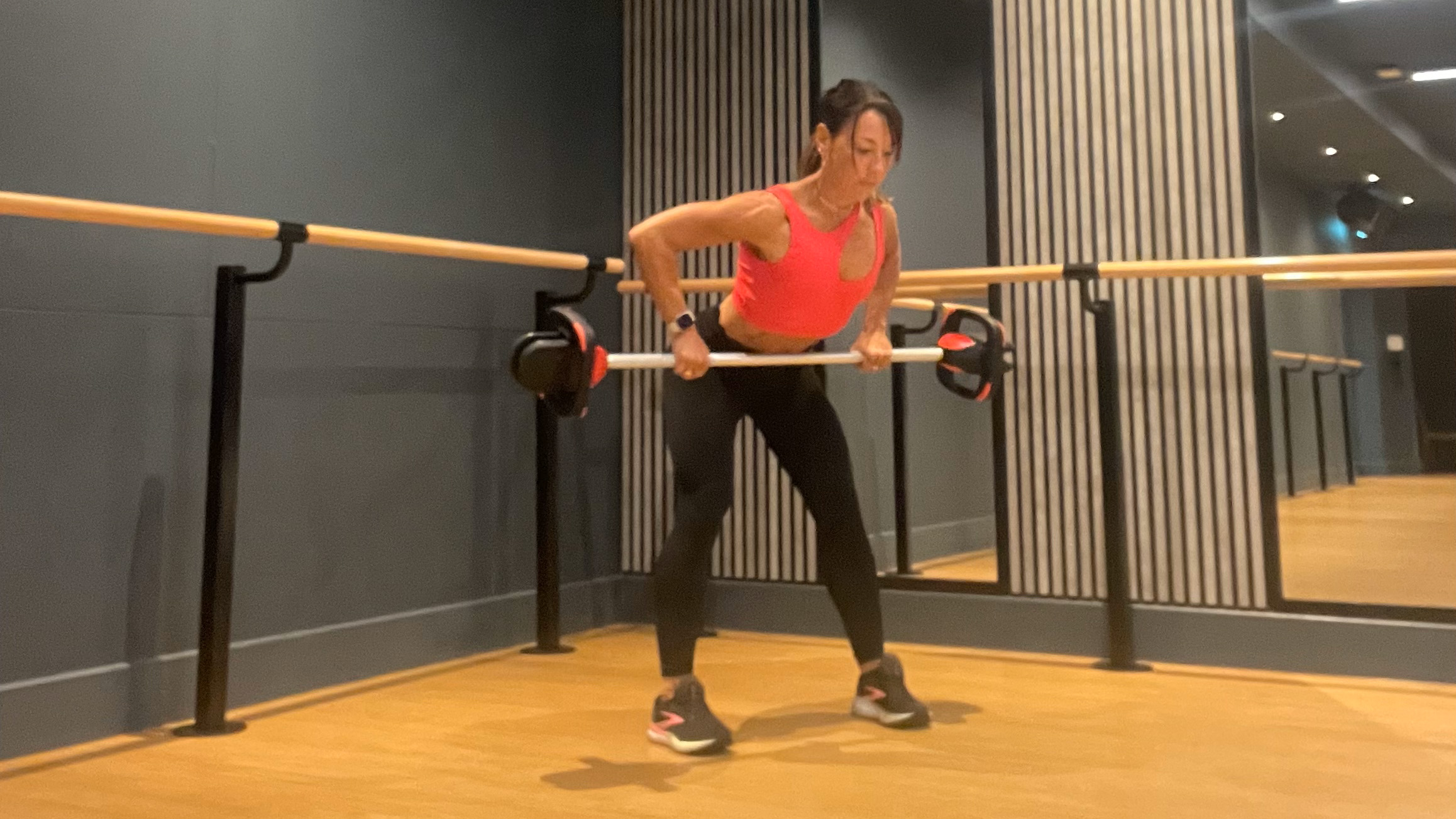 Lucy performing barbell back row