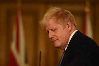 LONDON, ENGLAND - OCTOBER 16: Britain's Prime Minister Boris Johnson speaks during a virtual press conference on the latest coronavirus data at Downing Street on October 16, 2020 in London, E