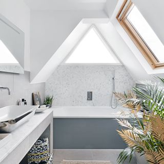 White loft conversion bathroom with large window