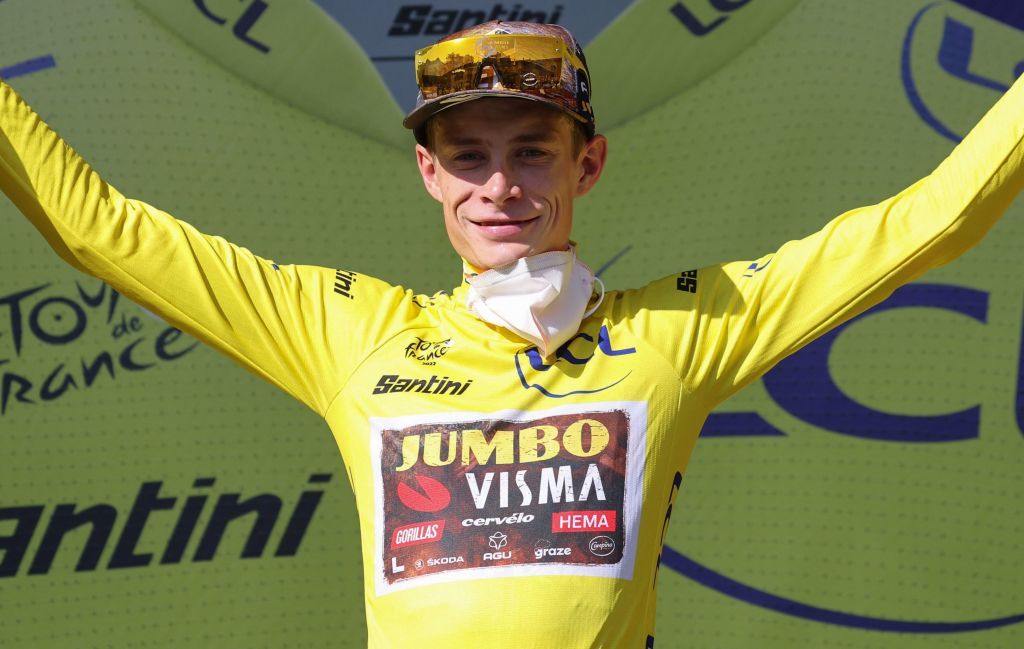 JumboVisma teams Danish rider Jonas Vingegaard celebrates on the podium with the overall leaders yellow jersey after the 15th stage of the 109th edition of the Tour de France cycling race 2025 km between Rodez and Carcassonne in sourthern France on July 17 2022 Photo by Thomas SAMSON AFP Photo by THOMAS SAMSONAFP via Getty Images