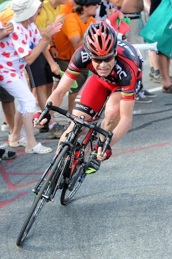 Cadel Evans takes a corner at speed.