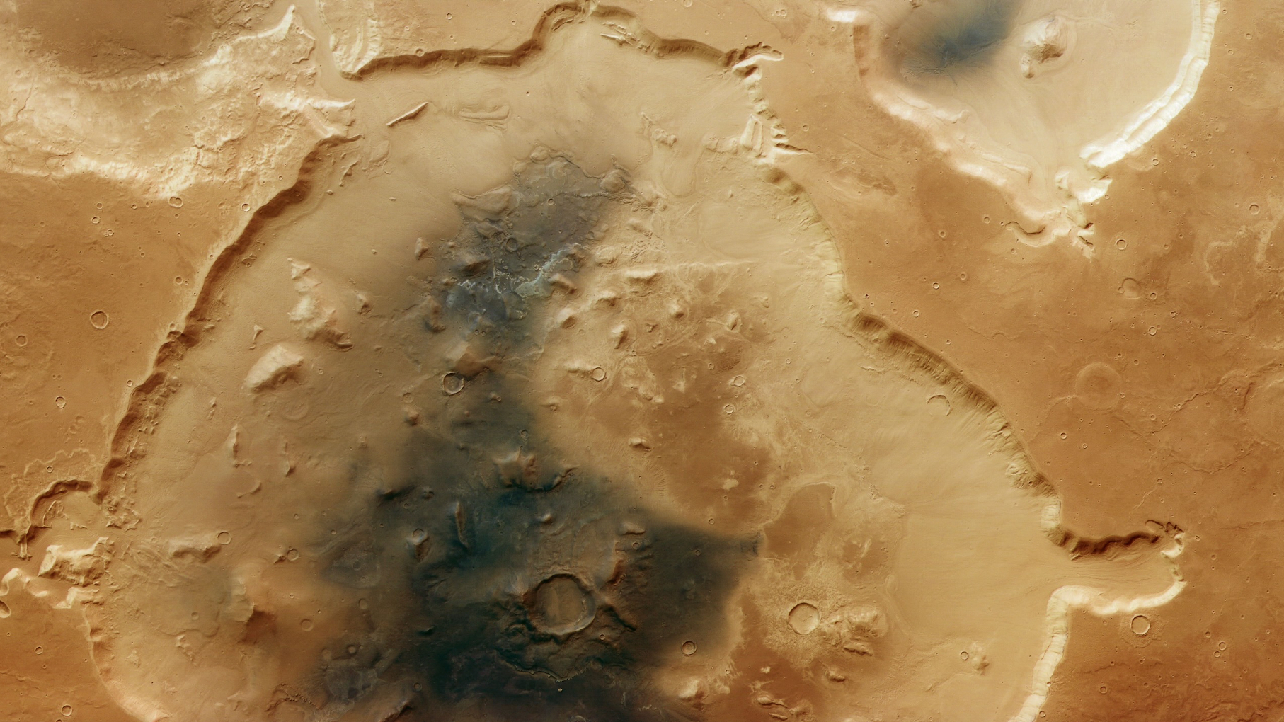 The nearly circular 75-mile-wide (120 kilometers) Deuteronilus Cavus crater lies in a transitional zone between Mars&#039; rugged southern highlands and smoother northern lowlands.