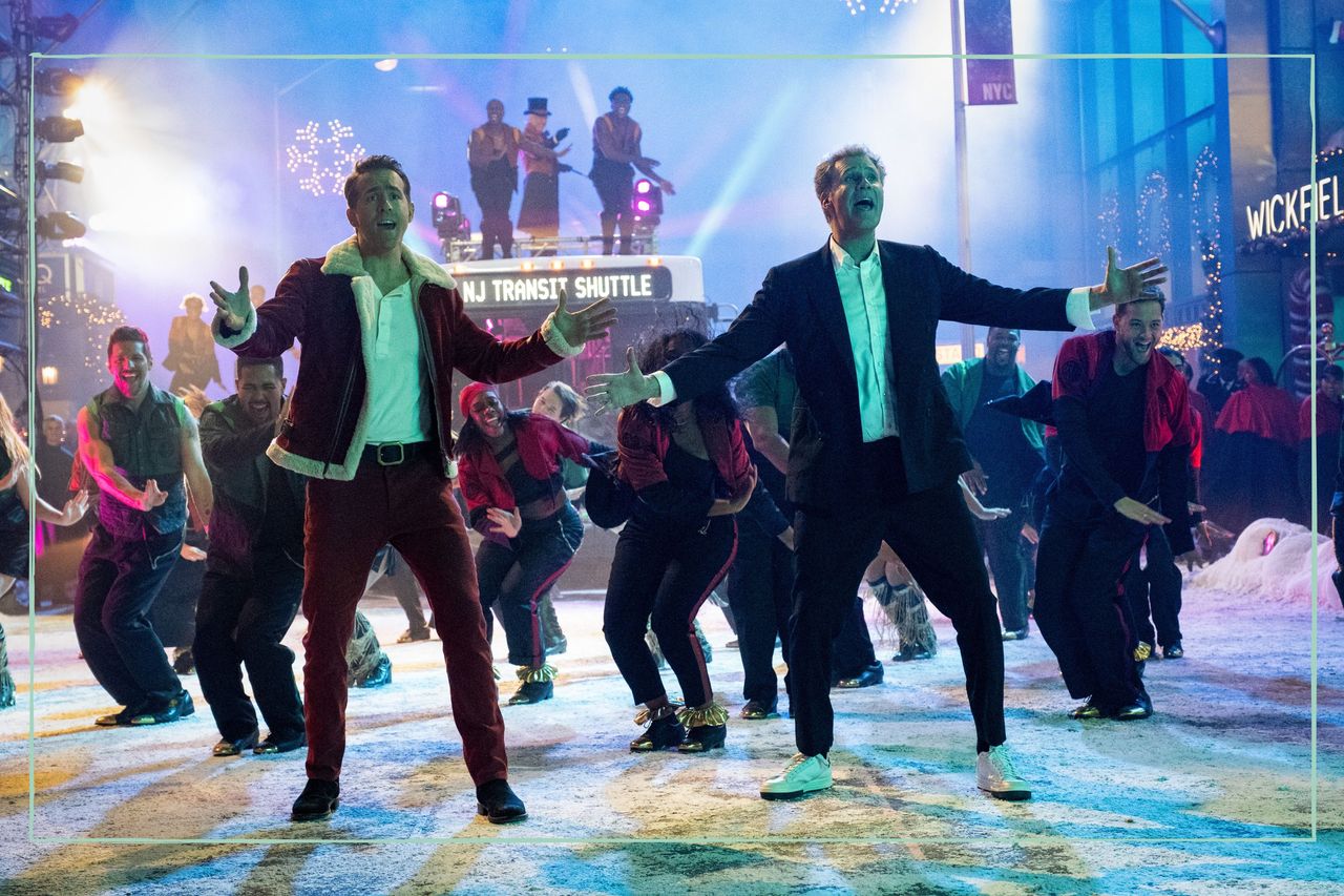 Ryan Reynolds (left) and Will Ferrell (right) performing on the set of Spirited