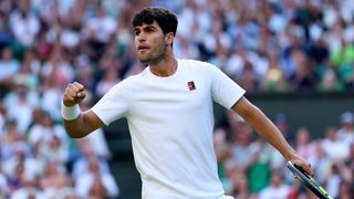 Carlos Alcaraz in action at Wimbledon 2025