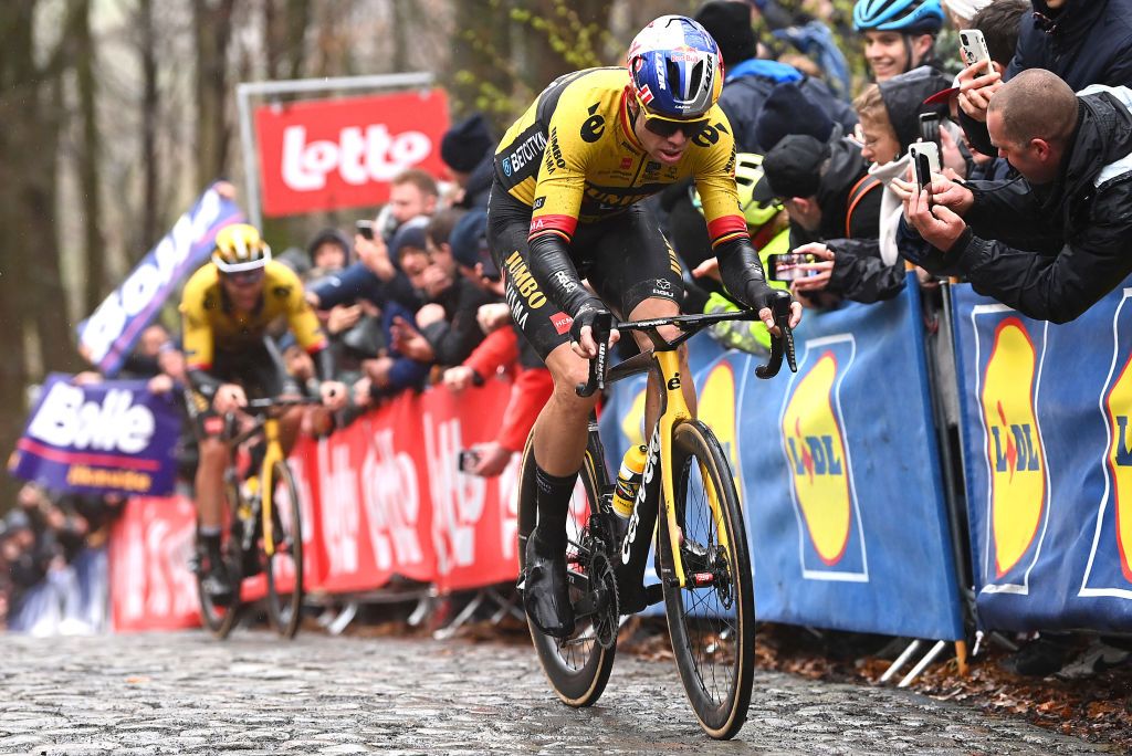 WEVELGEM BELGIUM MARCH 26 LR Christophe Laporte of France and Wout Van Aert of Belgium and Team JumboVisma compete passing through a Kemmelberg cobblestones sector during the 85th GentWevelgem in Flanders Fields 2023 Mens Elite a 2609km one day race from Ypres to Wevelgem UCIWT on March 26 2023 in Wevelgem Belgium Photo by Tim de WaeleGetty Images
