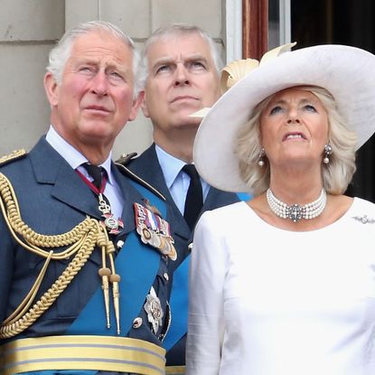 King Charles, Prince Andrew, and Queen Camilla stand on the balcony of Buckingham Palace to mark the centenary of the RAF on July 10, 2018