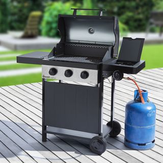 Gas BBQ on wooden patio decking