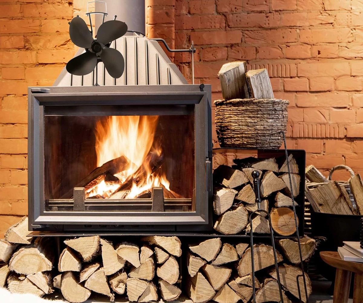 NETTA 4 Blade Woodburner Stove Fan on top of a log burner