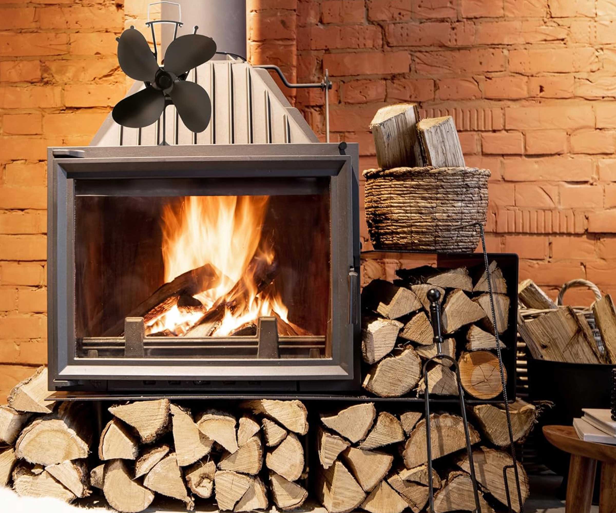 NETTA 4 Blade Woodburner Stove Fan on top of a log burner