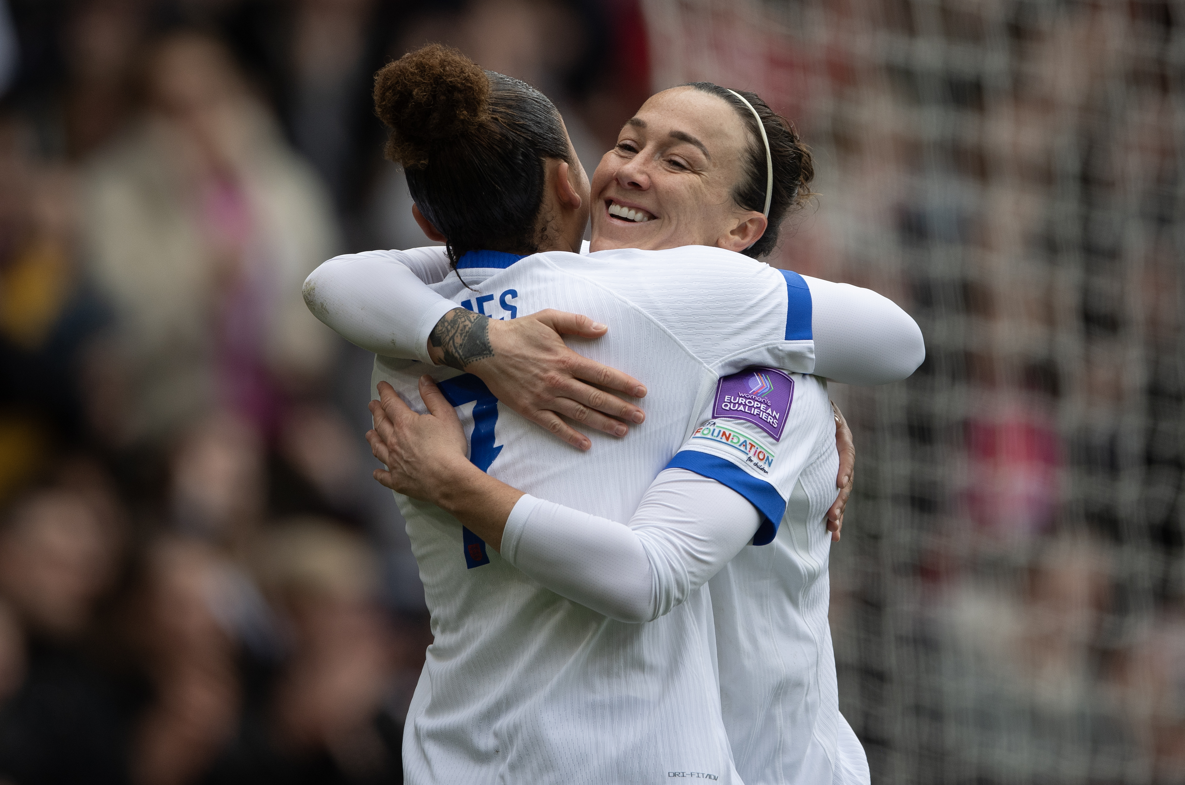 NOTTINGHAM, ENGLAND - MARCH 7: Lucy Bronze (right) celebrates opening the scoring for England with Lauren James during the 2027 FIFA Women's World Cup Qualifier between England and Iceland at City Ground on March 7, 2026 in Nottingham, England.