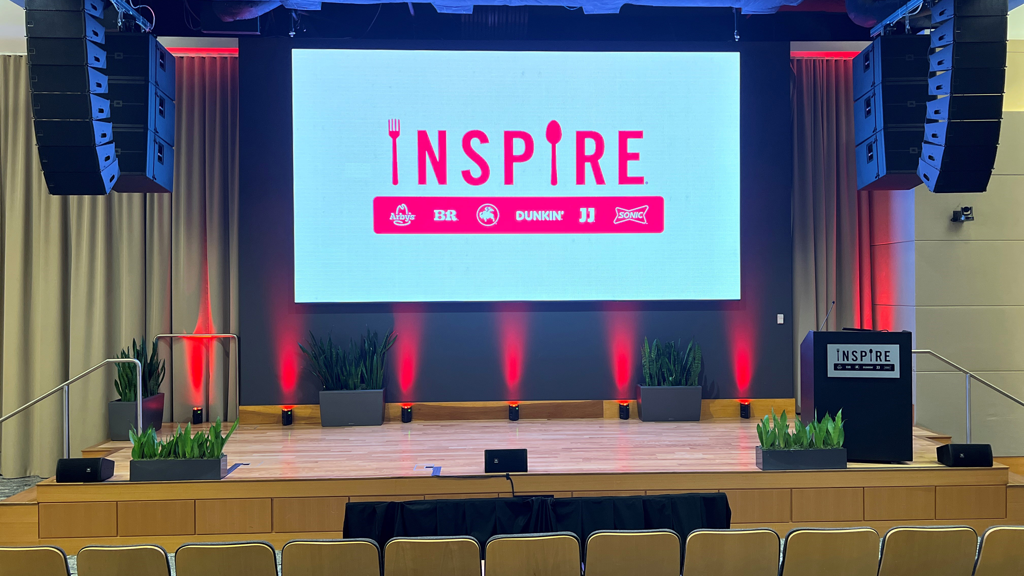Inspire’s Atlanta Global Support Center auditorium donned in HARMAN Professional audio solutions. 