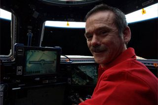 Canadian astronaut Chris Hadfield "spots" a UFO in the distance: "The view from where we fly the Canadarm2, with some orbital debris off in the distance," he wrote on Twitter.