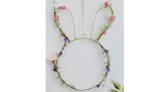 A wire bunny-shaped decoration with Spring flowers entwined around it - one of the best Easter decorations