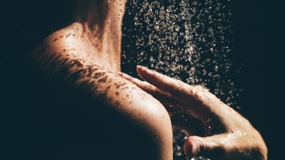 close up of woman showering