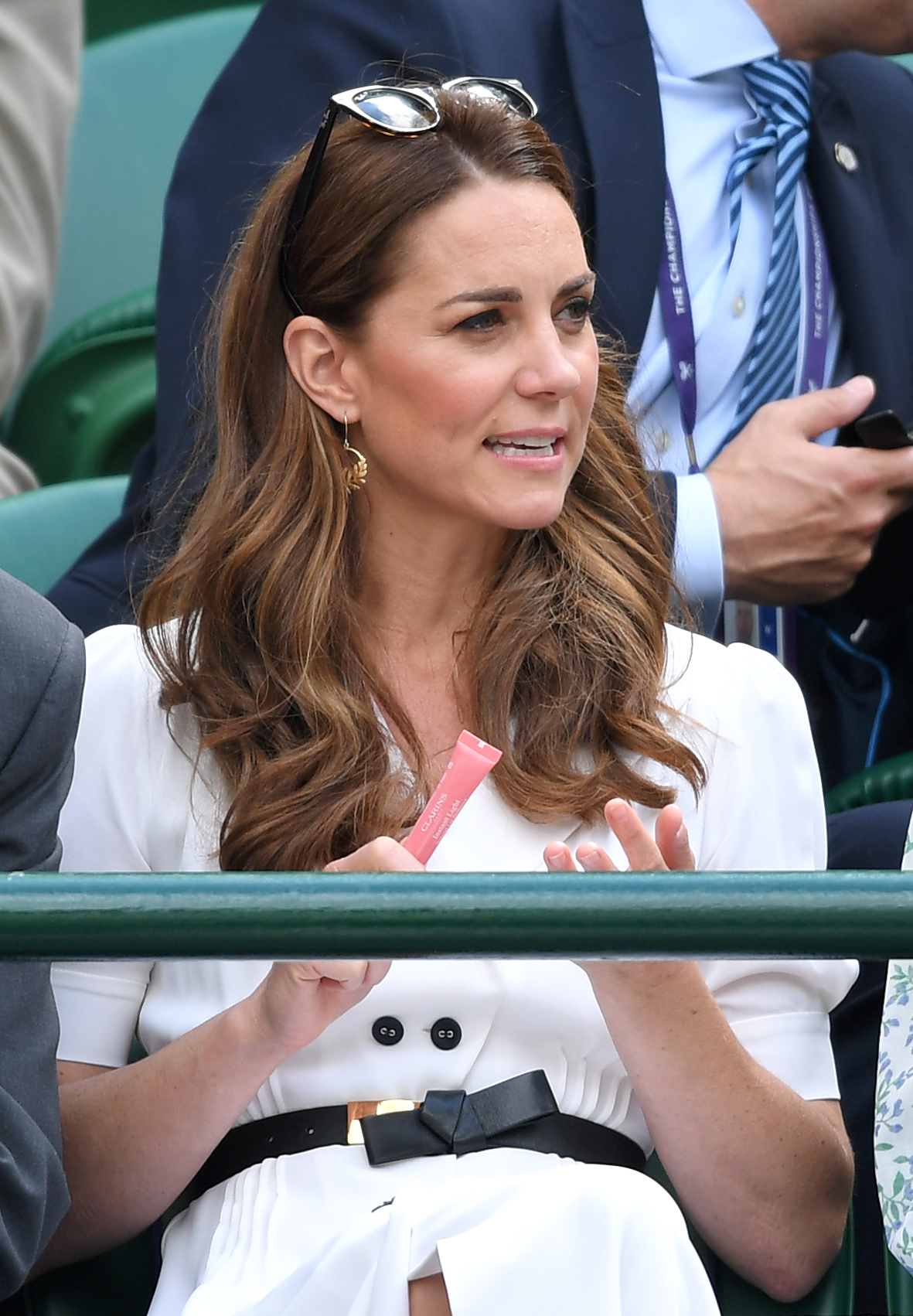 Kate Middleton using the Clarins Lip Perfector gloss at Wimbledon 2019