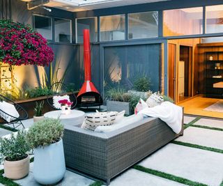 patio with outdoor fireplace and furniture