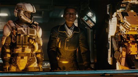 Starfield screenshowing showing two characters standing together with yellow lighting.