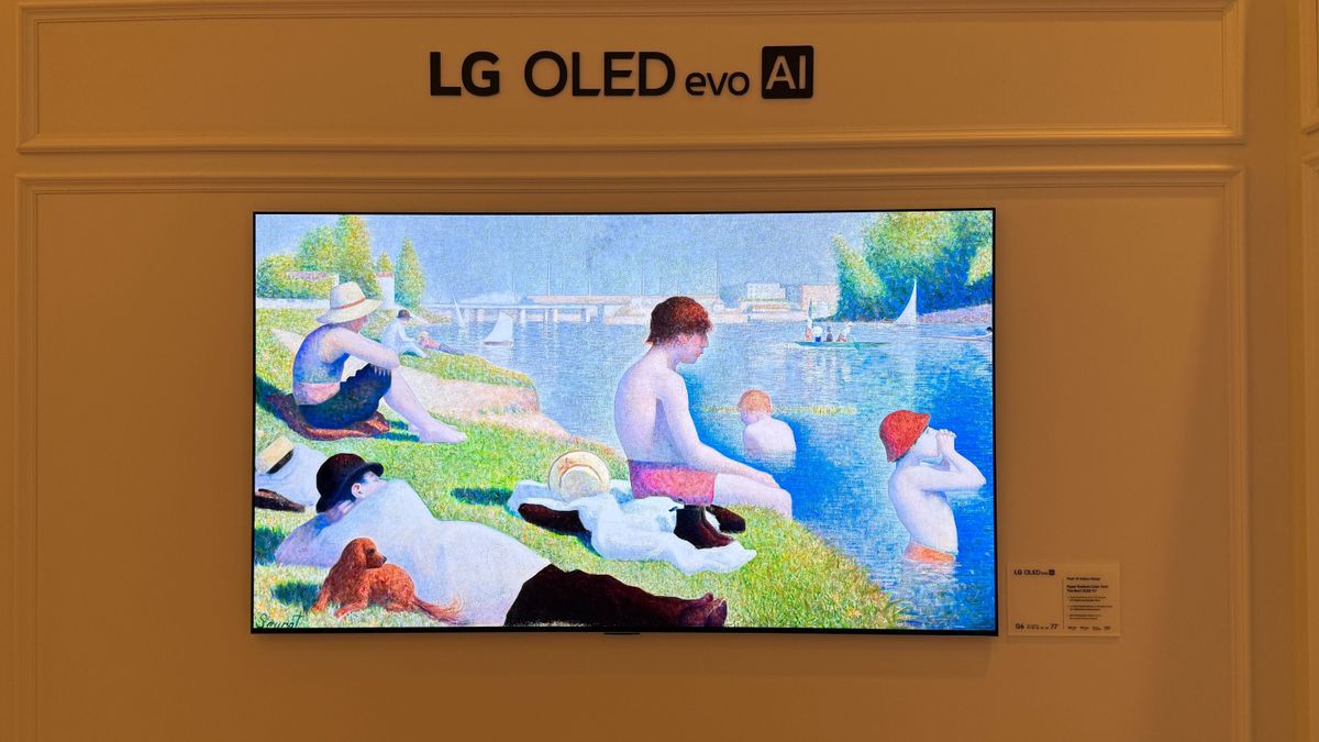 A wall mounted LG G6 OLED TV with LG demo content on screen