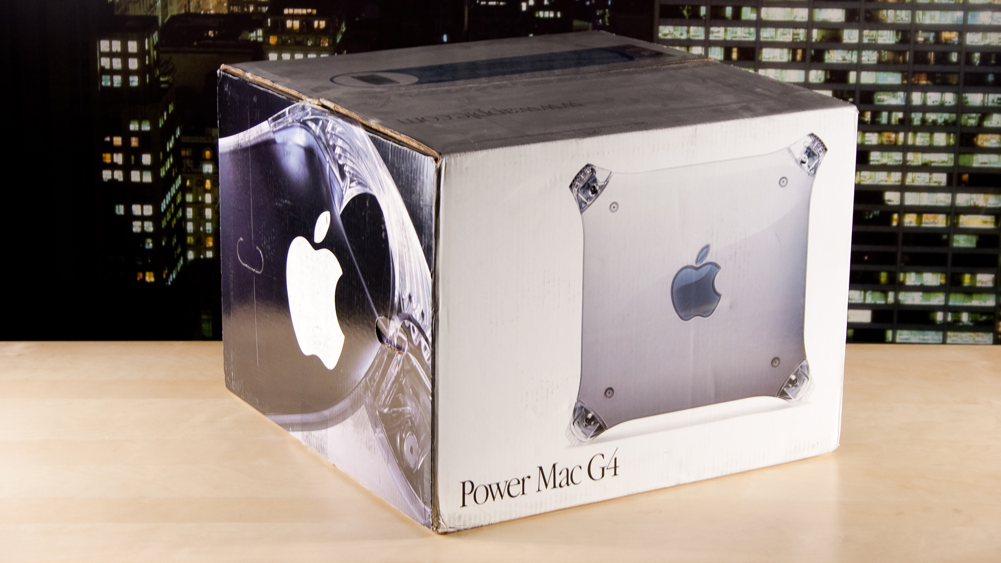A Power Mac G4 in a box on a desk