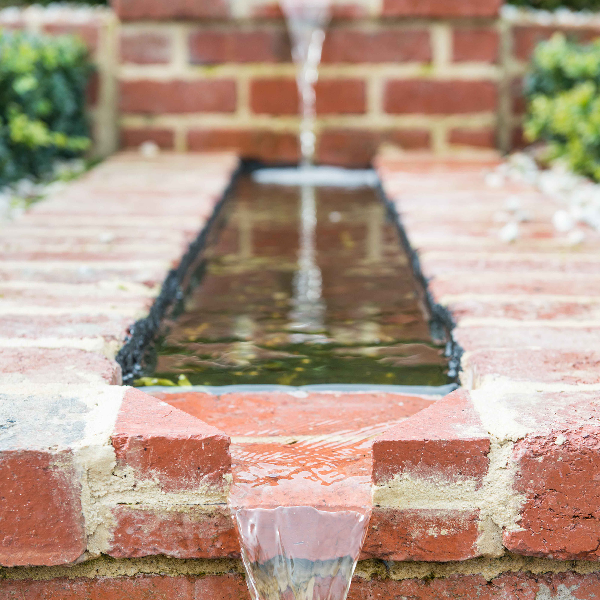 rectangular brick tank with running water