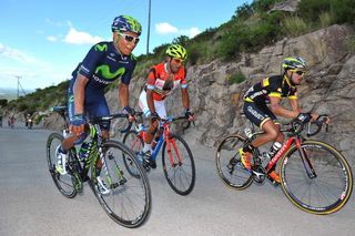 Nario Quintana climbs alongside Daniel Diaz and Roldofo Torres.