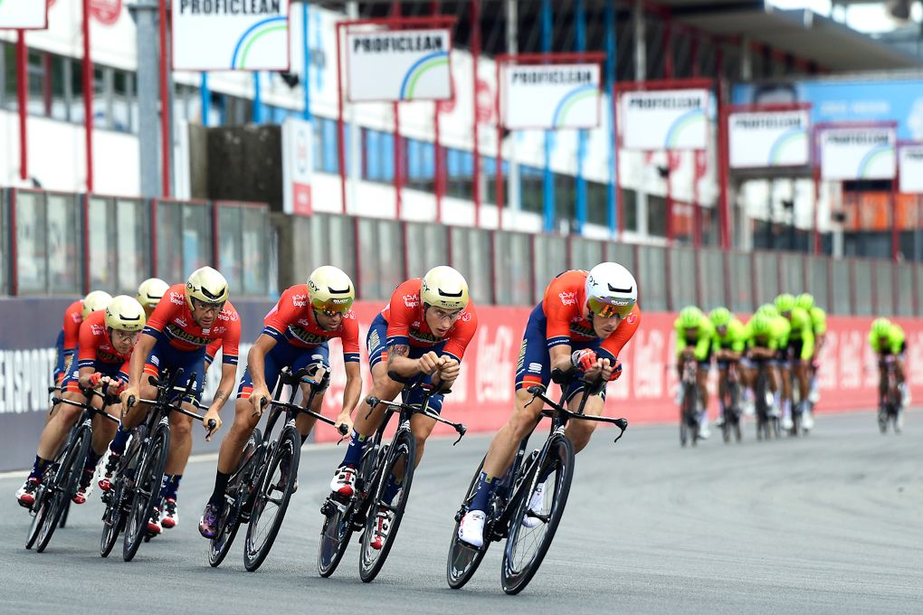 Bahrain-Merida riders practice their team time trial in Zolder as Trek-Segafredo are visible in the brackground