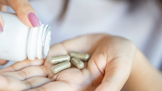 Woman taking supplements