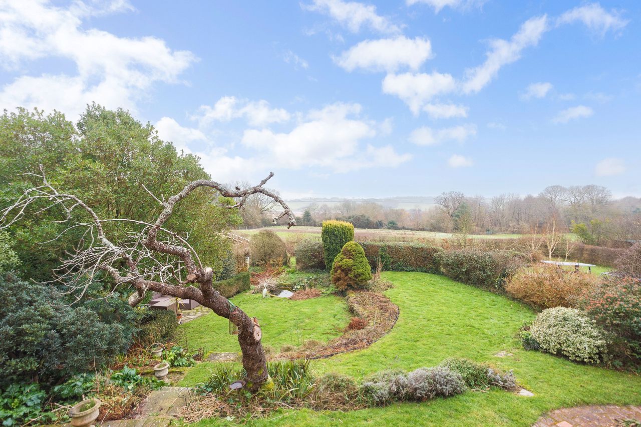Images of a very wonky house called The Cottage