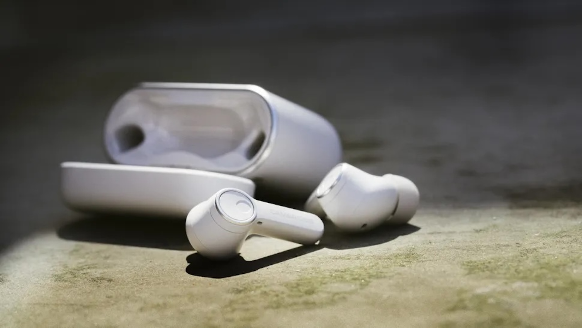 Cambridge Audio Melomonia a100 earphones sitting outside of the case on the side
