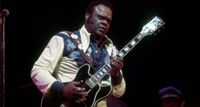 Freddie King wears a patterned western shirt and takes a solo on his Gibson ES-355