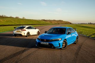 Two Honda Civic Type R cars, one white, one blue