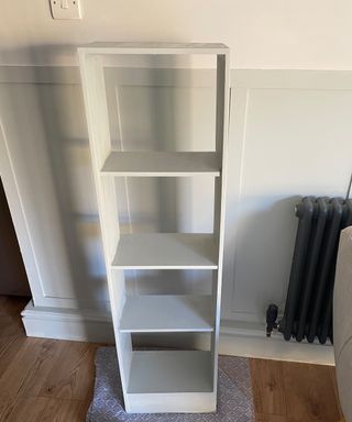 DIY bookcase painted in pale green paint