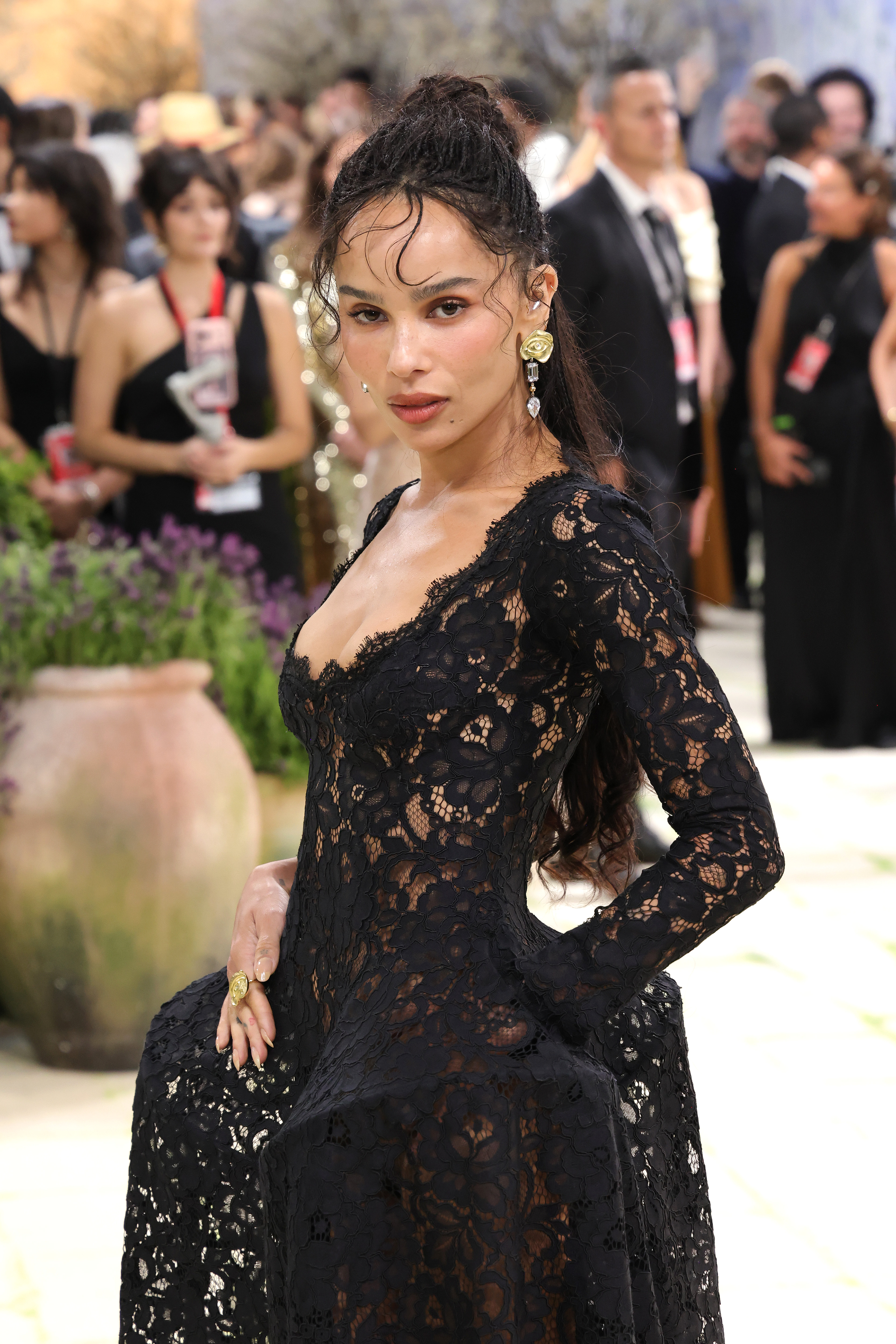zoe kravitz wears a lace saint laurent dress.