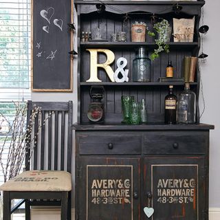 dresser with shelves and chair