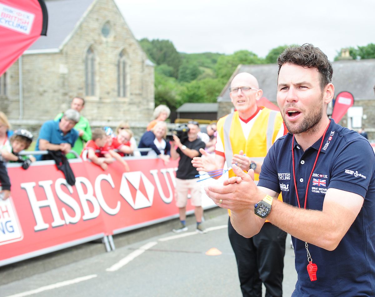 Mark Cavendish cheers on the children taking part in an event at the British national time trial championships