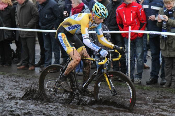 Rob Peeters (Telenet-Fidea) rides through the mud in the Netherlands
