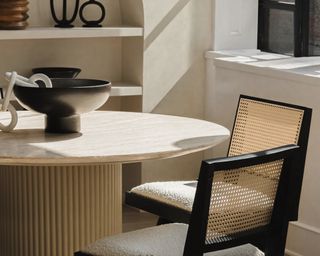 Neutral table with rattan chair