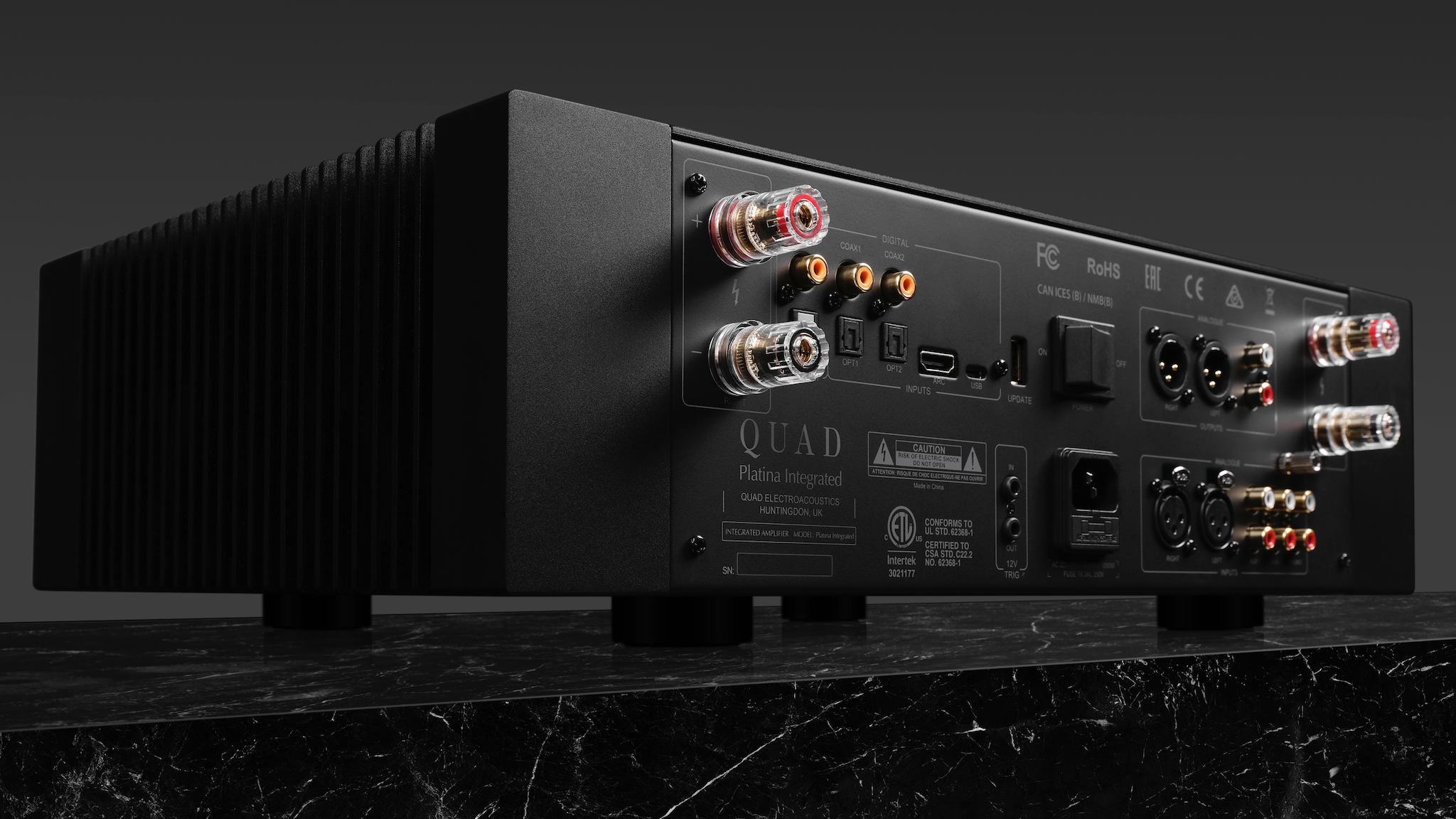 Rear view of the Quad Platina Integrated amplifier on a dark grey background
