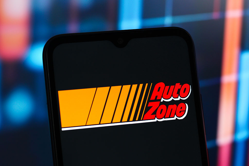 The AutoZone logo is seen displayed on a smartphone screen