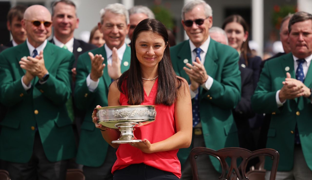 Davis holds the trophy