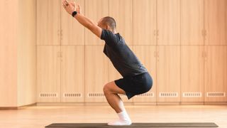 Man practicing yoga in a studio