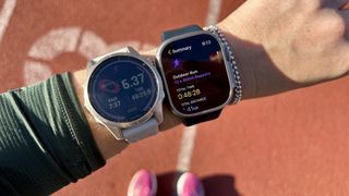 A photo of the Apple Watch Ultra and the Garmin Fenix 7