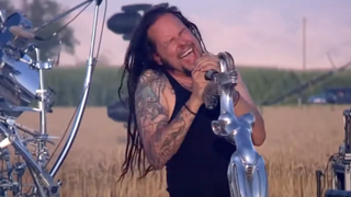 Korn performing in a cornfield