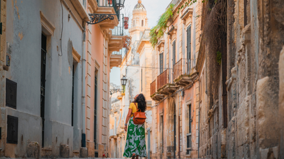Woman walking down the street in Puglia