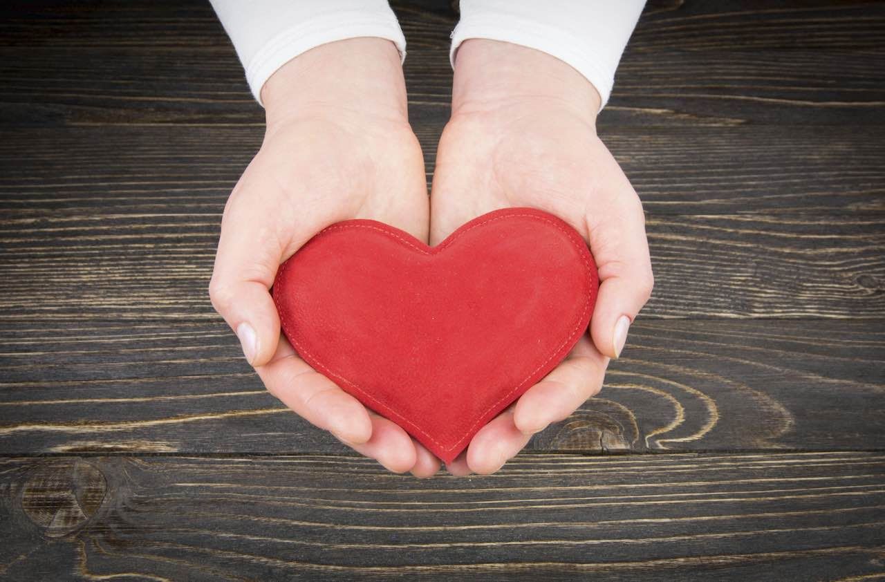 Redheart in woman hands