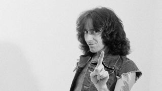 Bon Scott wags his finger art the camera